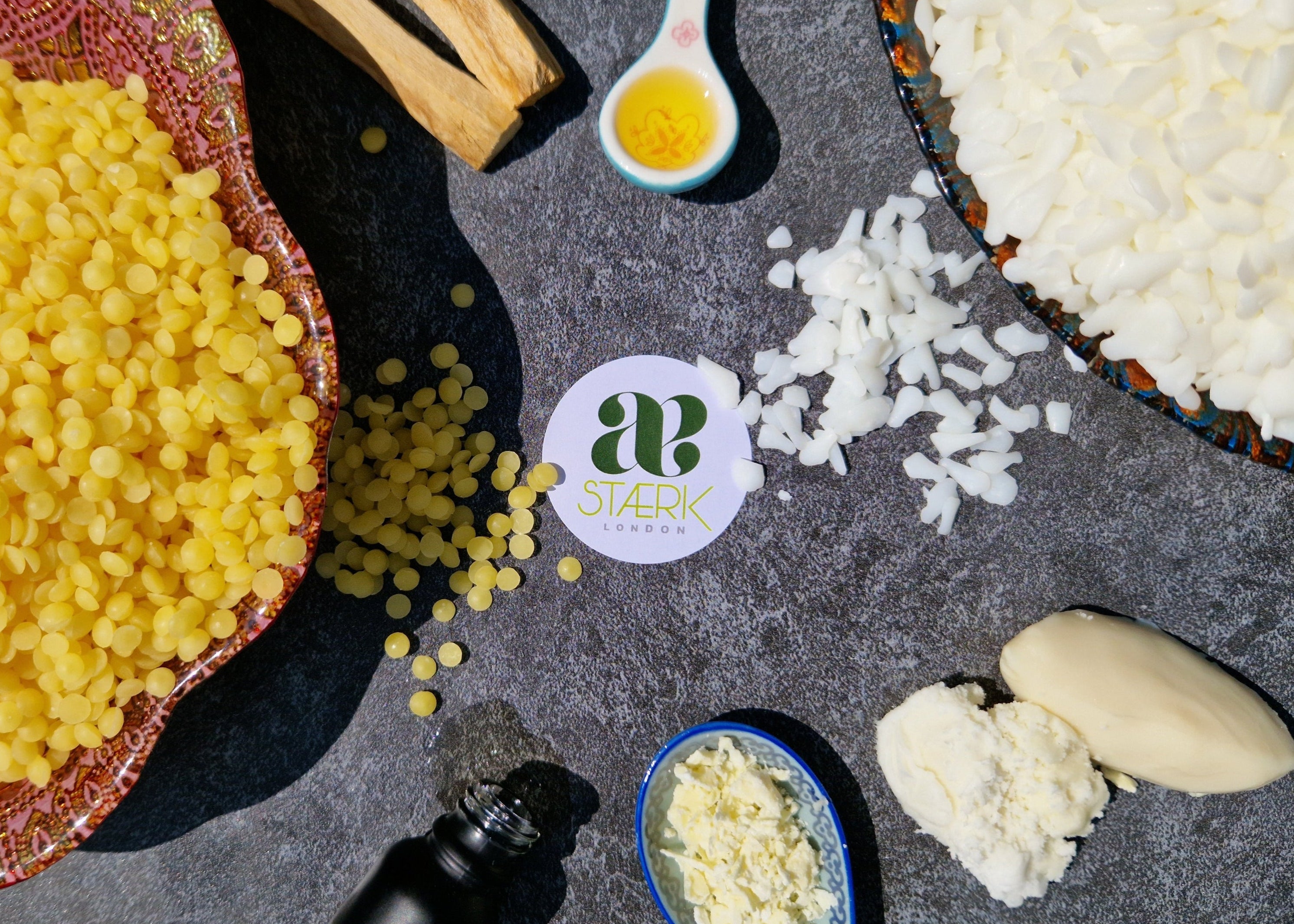 Ingredients on a dark surface with Staérk logo.